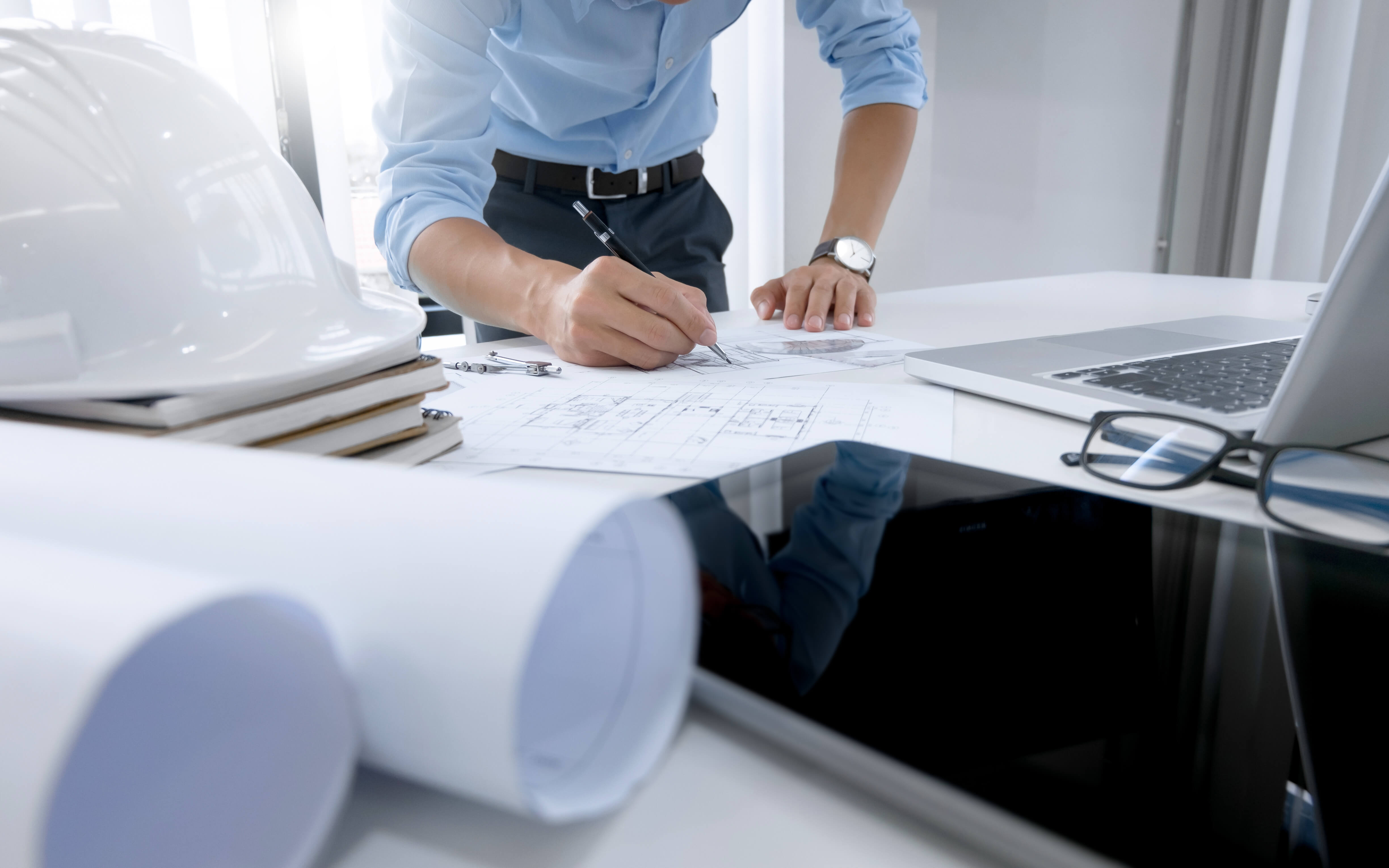 Implementation-Partner man looking at plans