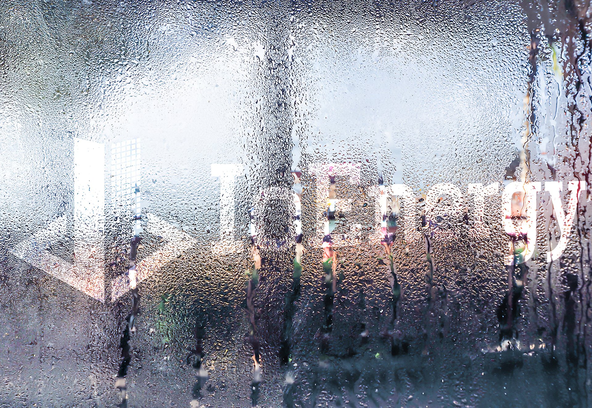IoEnergy Logo on Rain Spattered Window