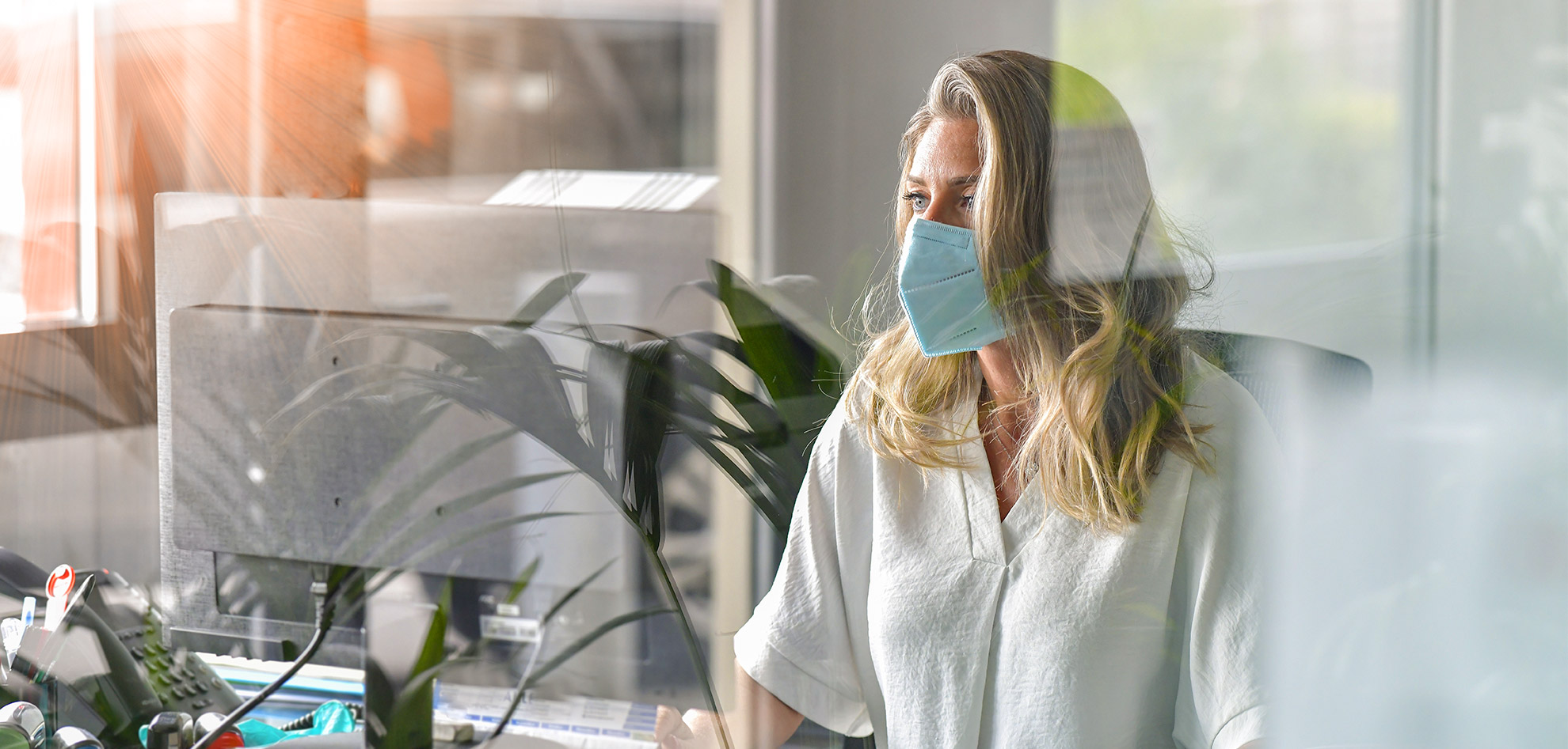 Woman working while wearing mask