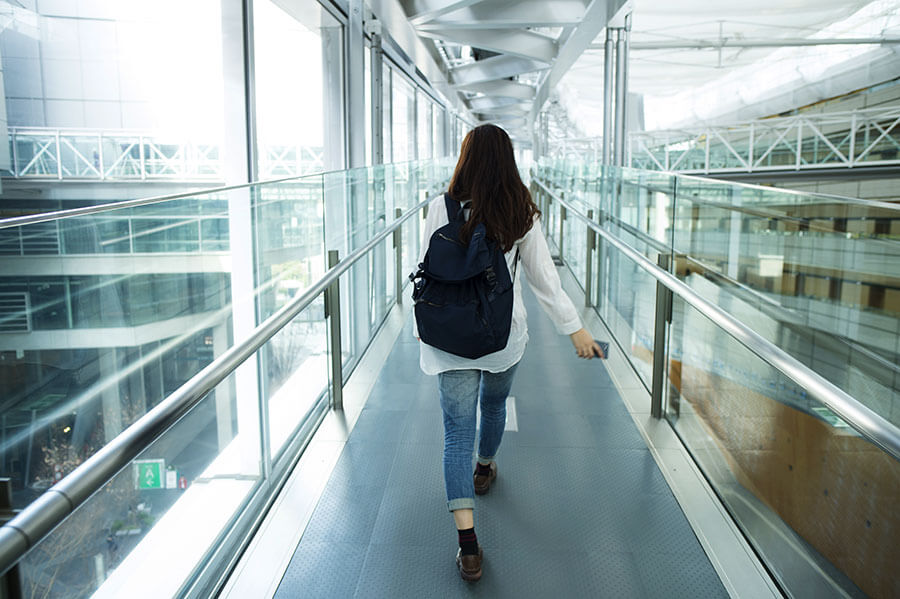 Woman with backpack walking