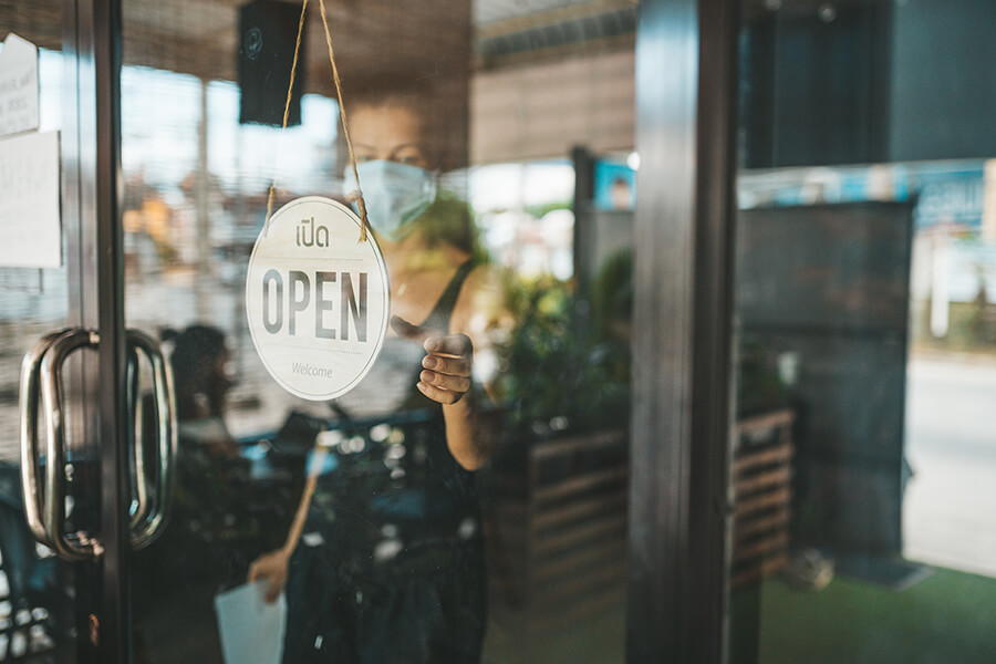 Woman opening business for the day